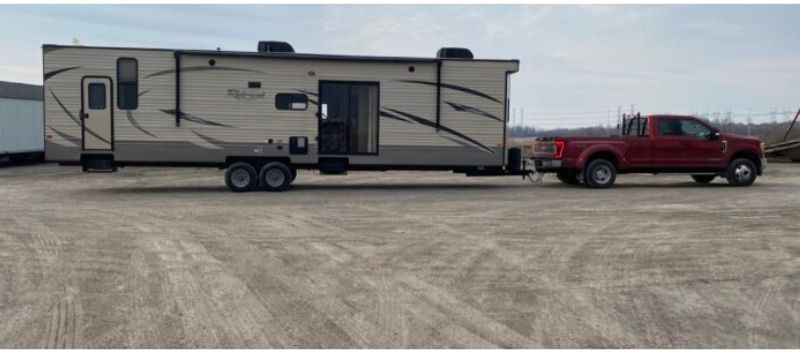 Dually truck towing a large park model RV - truck towing specifications