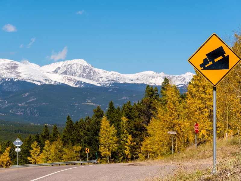 Steep grade sign on a mountain road - RV towing on steepm grades