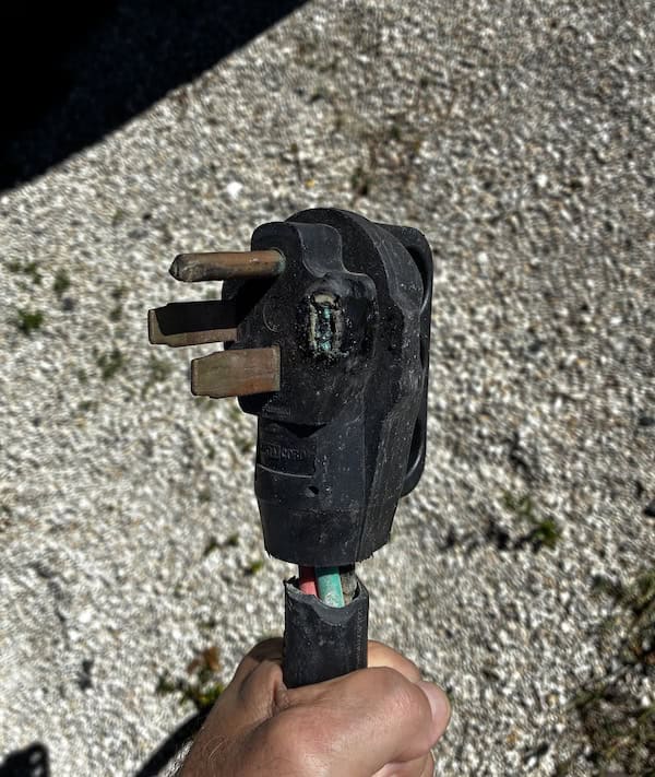 RVBlogger RV plug that melted. Wish I was using a surge protector