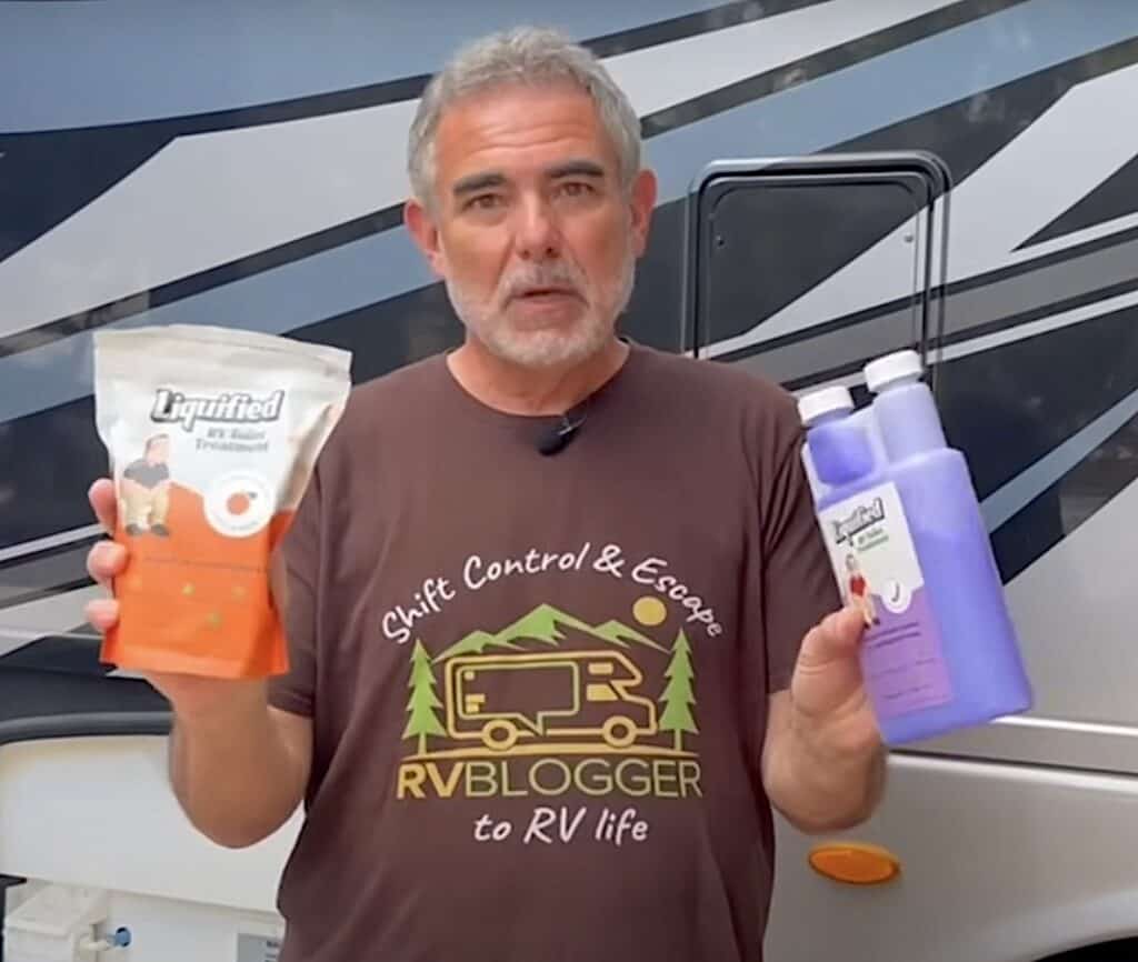 Mike from RVBlogger holding Matts Liquified tank cleaner